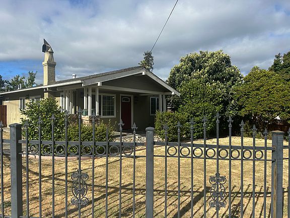 Front yard. Wrought iron fence surrounds front and side front yard
(redwood fence in backyard)