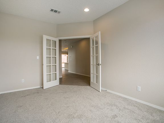 Directly off the entry, you ll find a private den that has been enhanced with our French door upgrad