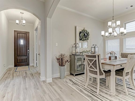 Grand Entry*Formal Dining With Upgraded Light Fixture*Note The Neutral Colors.