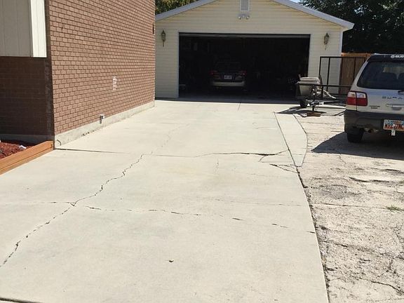 Room for a small utility trailer on the right, or cars outside