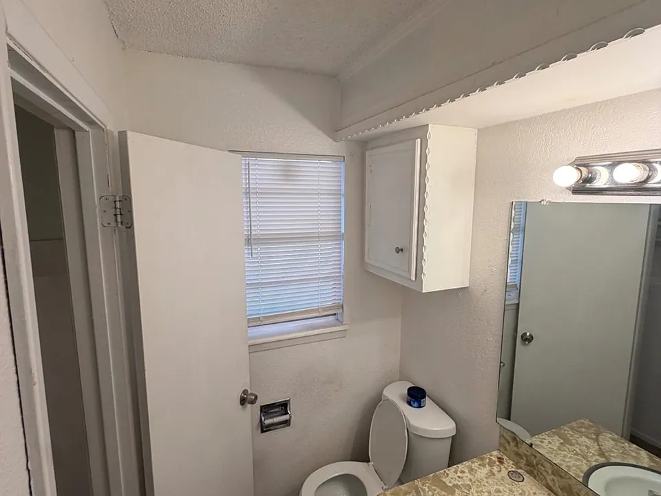 Closet space located in half bathroom, which is located in the master bedroom.