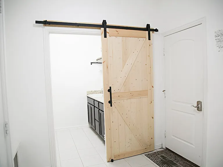 View of mudroom and utility room from the entry hall room.