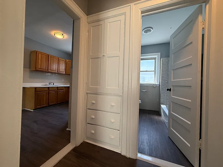 Hallway closet with built-in storage