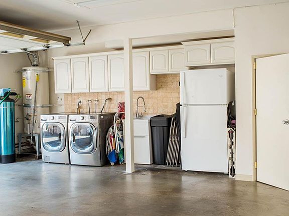 washer/dryer and more storage in the garage