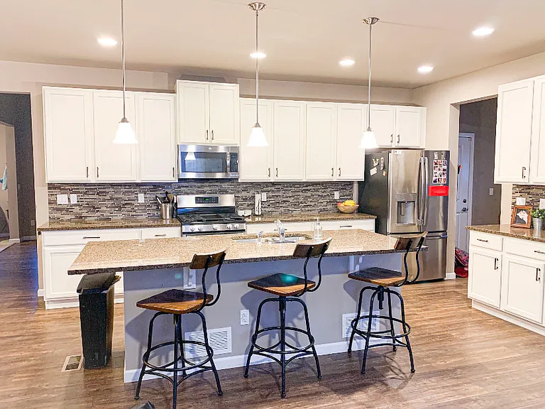 Large Kitchen with Island and walk in pantry in mudroom area