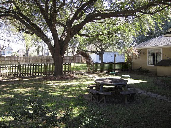 PARK LIKE BACK YARD WITH GRAND OAK TREES-THERE IS NO MUD TAXES OR HOA
