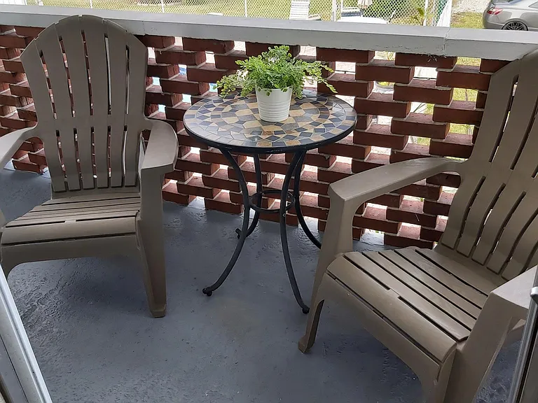 Balcony with 2 chairs and table