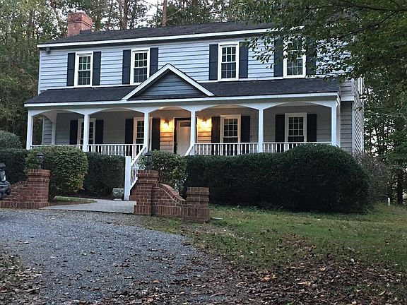 Large, covered front porch. Perfect for rocking chairs. Circular driveway.