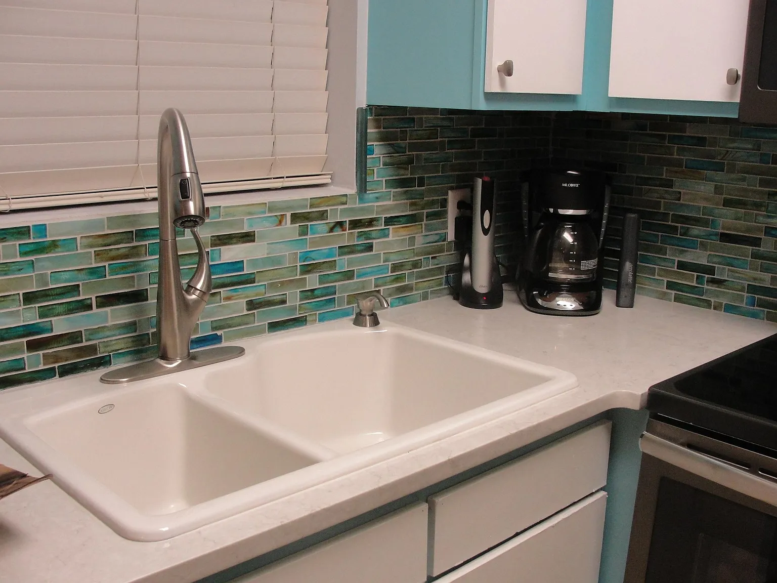Beach glass tile backsplash with granite countertops! All small appliances and nice upgrades everywhere!