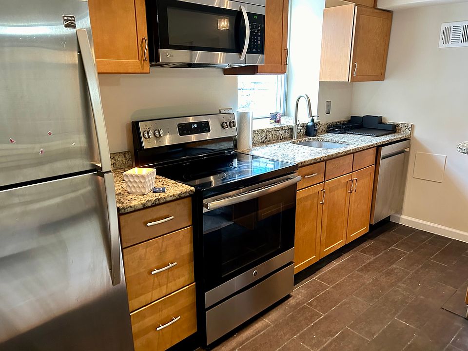 Full kitchen with brand new GE stove and dishwasher.