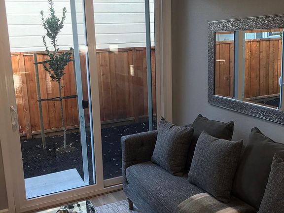 Living area and sliding door to back yard (sample photo unit 2-5, some units are a mirror image)