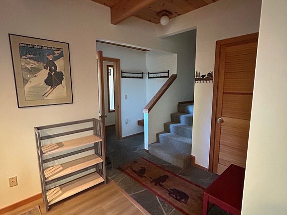 Entryway with coat closet and hooks