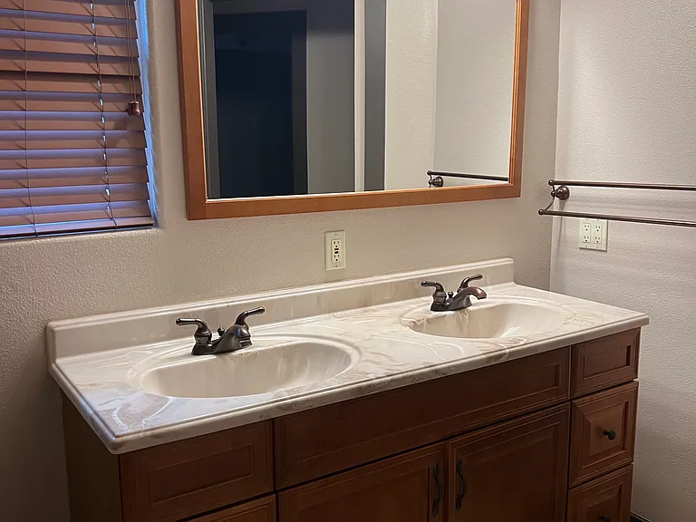 Main bath double sink with separate water closet and full shower