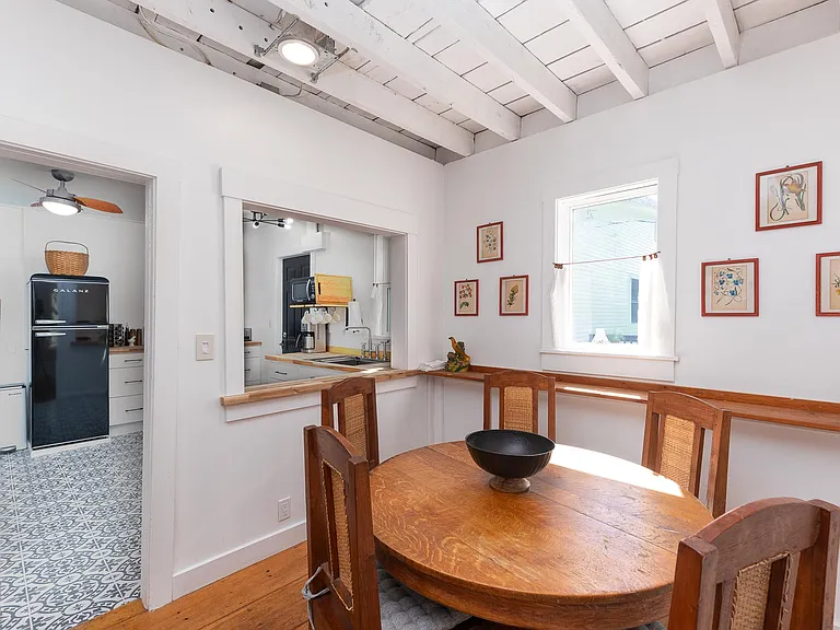 Dining space looking thru pass thru into kitchen