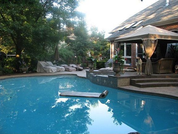 Heated inground pool and jacuzzi with waterfall