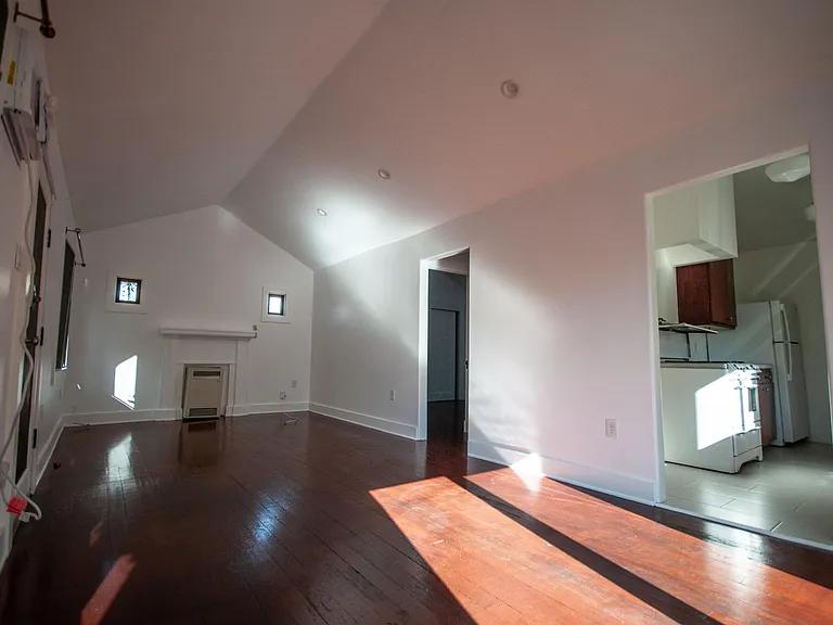Living room, bed room and bathroom through middle door