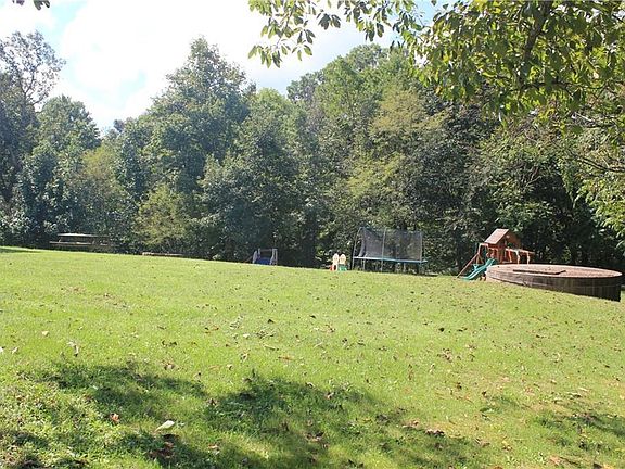 Fun yard. Cement cistern in view on right.