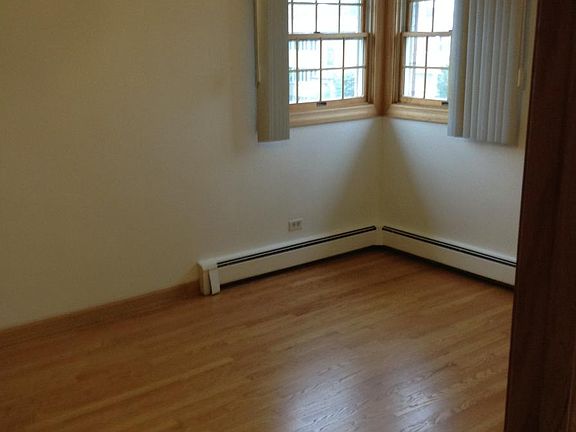 Master bedroom with hardwood floors