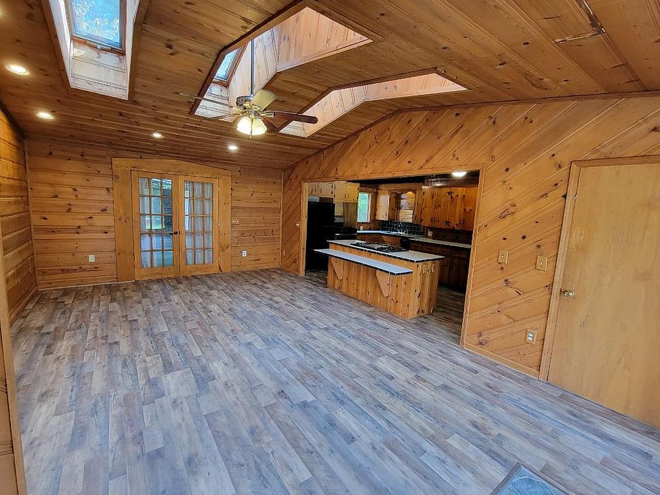 Living room with view of lower foyer entrance (or second bedroom area)
