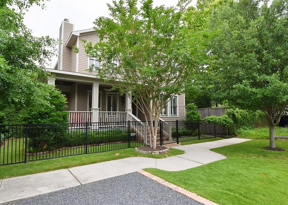 This 2011 built home sits on two lots. The L-shaped porch is a great pace to relax and talk to passing neighbors. Alley-access garage in back, but also parking in front.