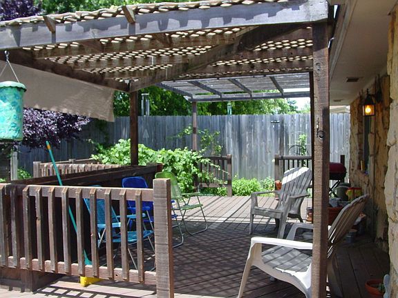 Wonderful back deck, lush landscaping & Storm cellar