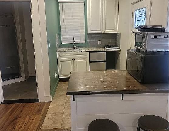Kitchenette with countertop appliances.