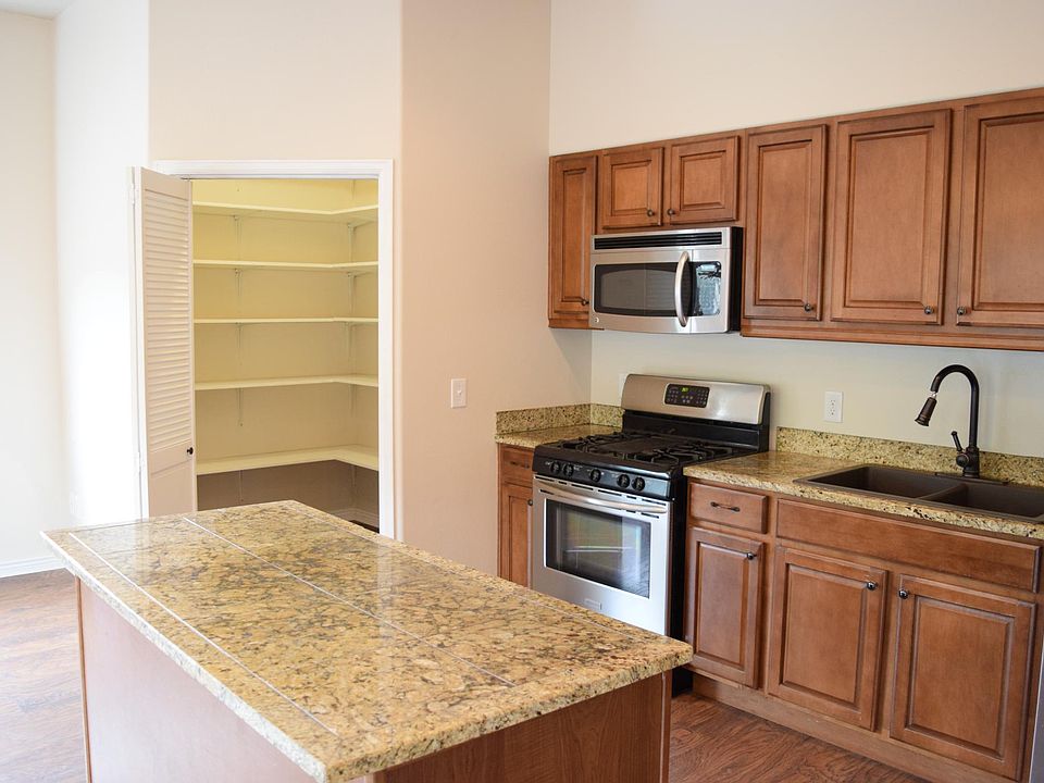Walk-in pantry and kitchen.