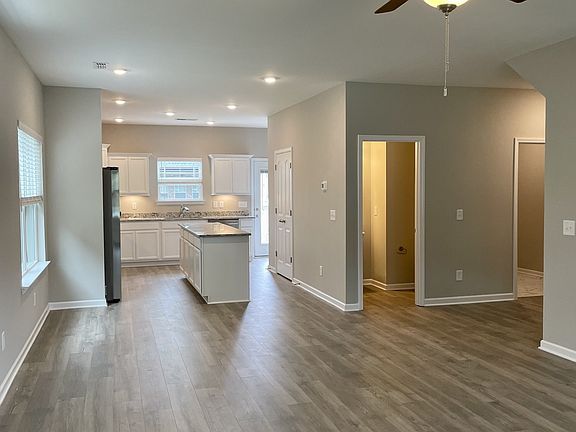 Downstairs also features a half bath and large laundry room