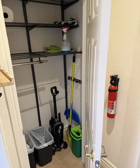 Storage closet with cleaning supplies