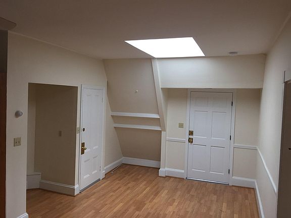 Central room with both exit doors and skylight.