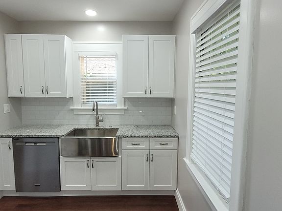 New Stainless dishwasher, large farm sink, and new cabinets with lots of storage.