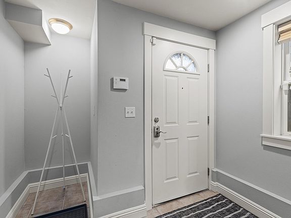 Large mudroom, laundry area, and garage on 1st floor. (Picture taken of another unit, same floor plan but mirror-imaged)