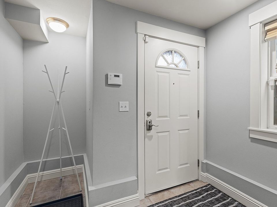 Large mudroom, laundry area, and garage on 1st floor. (Picture taken of another unit, same floor plan but mirror-imaged)