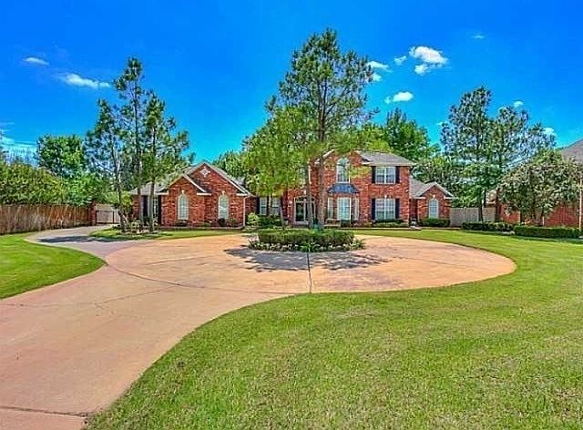 Amazing circle drive in front! With powered gate to enter your 3 car garage!