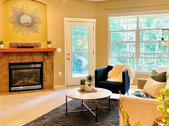 Living area with cozy gas fire place (staged)