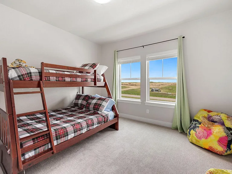 2nd upstairs bedroom with twin over full bunk bed. Views of the Rockies!!