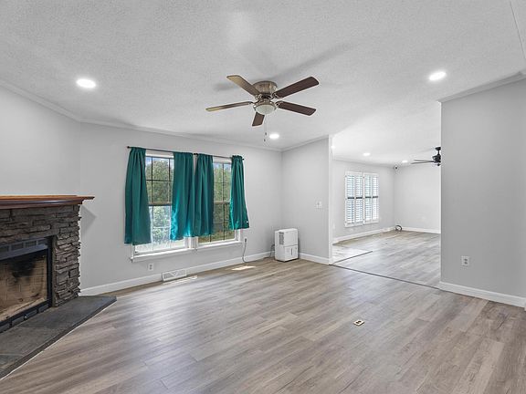 Formal Living Room with wood-burning stone fireplace