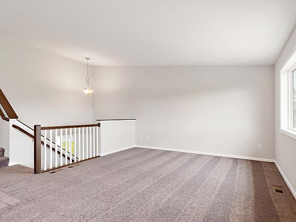 Enjoy comfortable living and entertaining areas on the upper level of this split-level home.