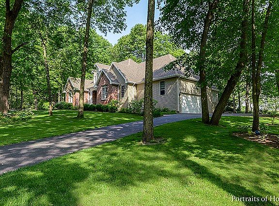 Nestled on a gorgeous acre lot in a park like setting...paradise!