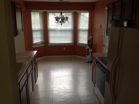 Kitchen is currently being renovated with new floors, white shaker style cabinets and granite countertops