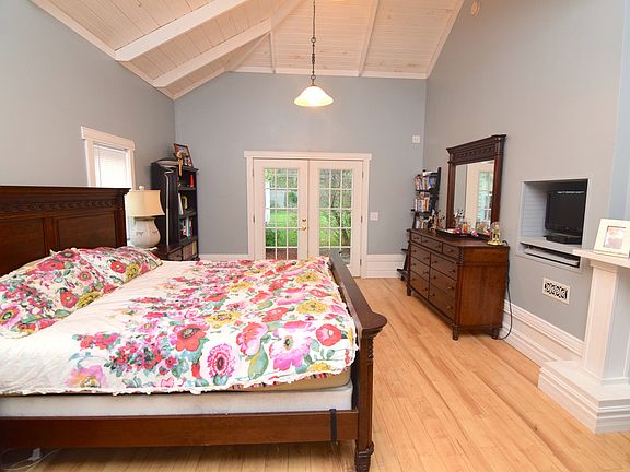 Huge master bedroom. Notice the trim work; like nothing you will find in this price range. Vaulted ceilings and access to the back yard so you can enjoy the views.