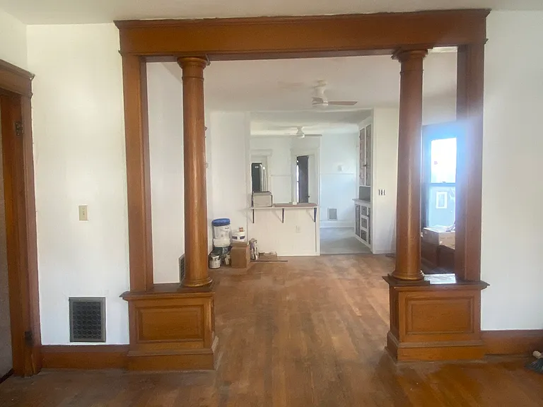 The beautiful wooden trim and columns have been maintained.