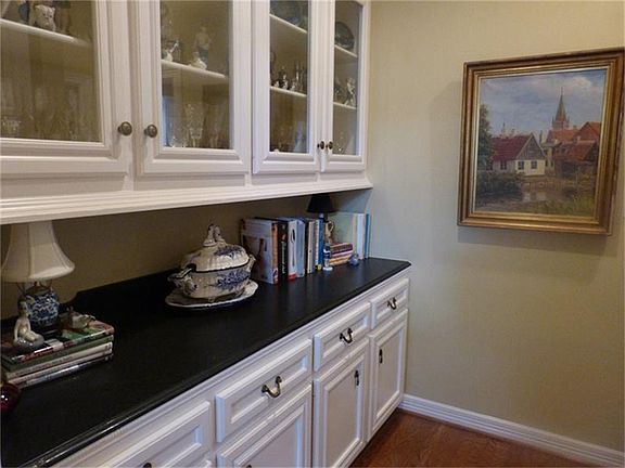 The Butler's Pantry has an abundance of glass  and wood cabinets to display your china and stemware.