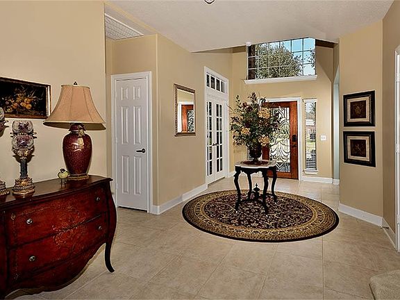 Open the door to prestige and elegance! This gracious foyer is impressive & welcoming.