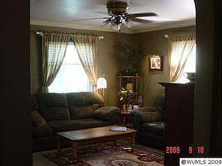15 x 15 living room with wood stove and crown molding