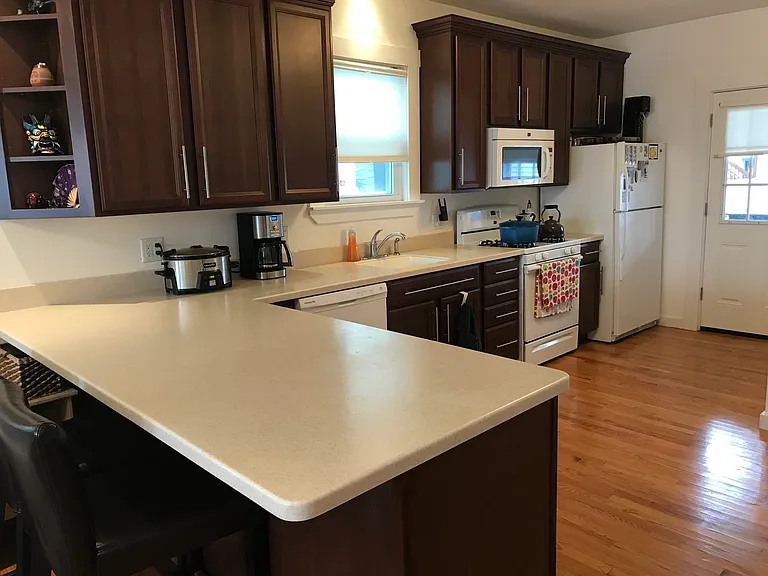 Kithchen is large and has a dishwasher and is an open concept first floor plan and has a lovely porch off it