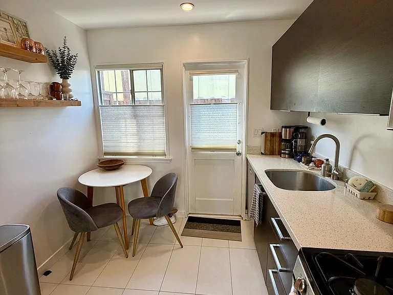 kitchen with quartz stone counters and room for a small dining table