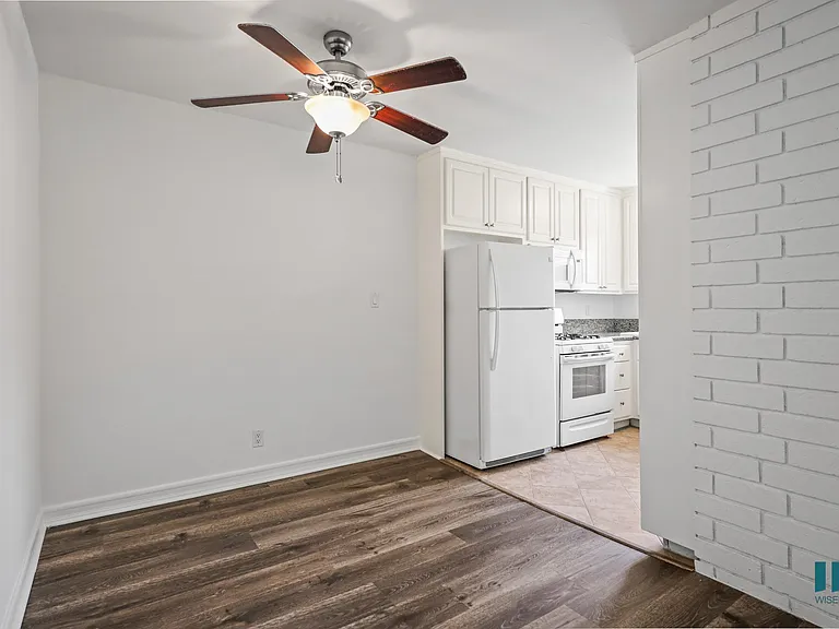 Dining Room with Overhead Ceiling Fan and Vinyl Flooring