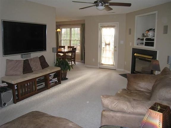 Bright living room with available 50" wall-mount Sony LCD TV