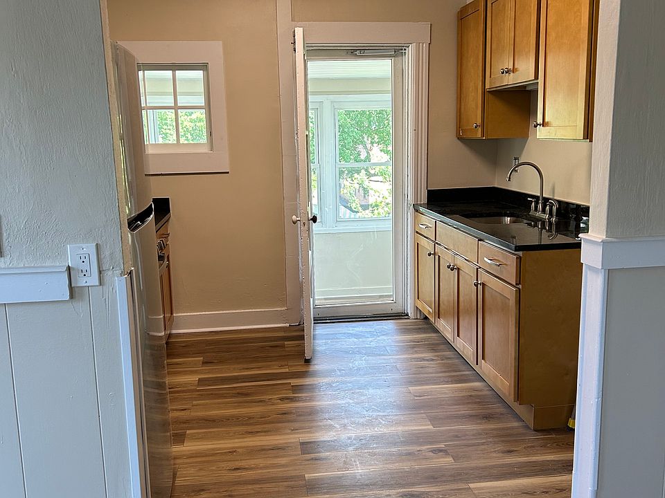 View of 'galley' kitchen. Stackable washer/dryer hook-up is to right of counter with sink.